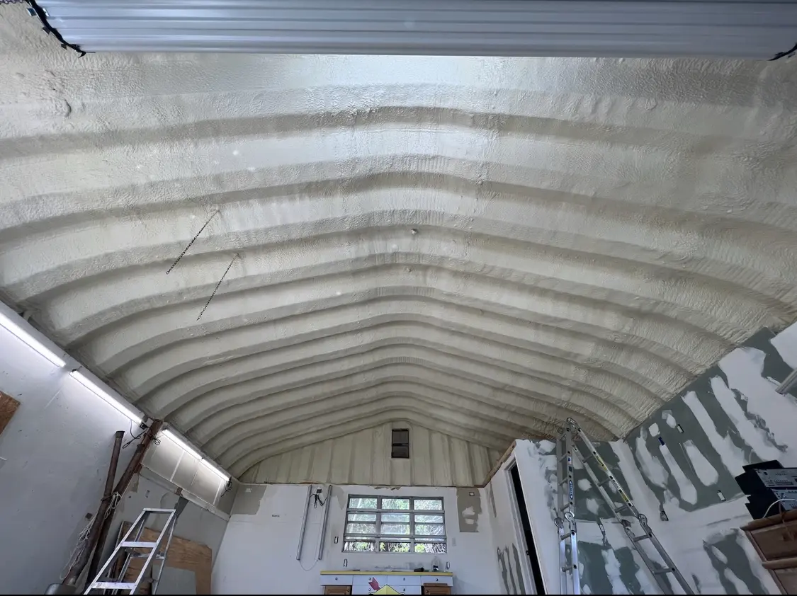Spray polyurethane foam applied to the underside of a metal roof deck in Ralston